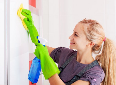 Carpet cleaning team using safe work practices